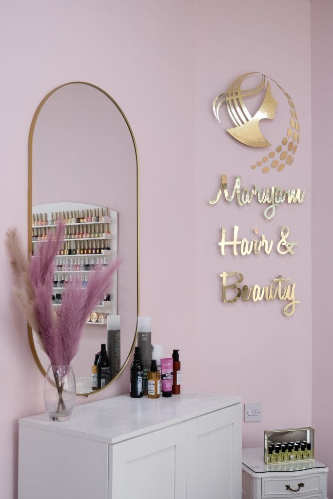 Maryam Hair & Beauty logo wall and styling mirror in the Whitechapel salon